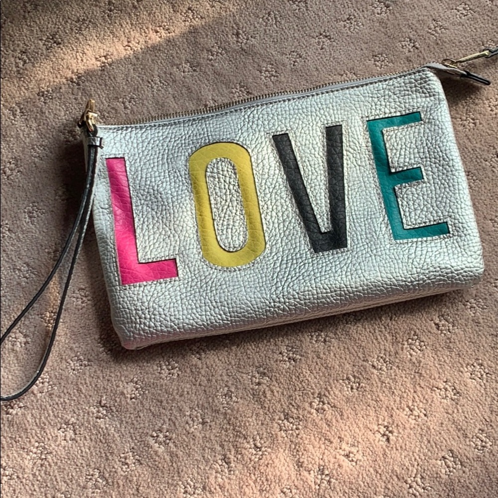 Juicy couture wristlet LOVE with pink lining